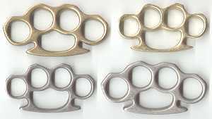 Upper left, large brass knuckles;
Upper right, standard brass knuckles;
Lower left, standard aluminum knuckles;
Lower right, large aluminum knuckles